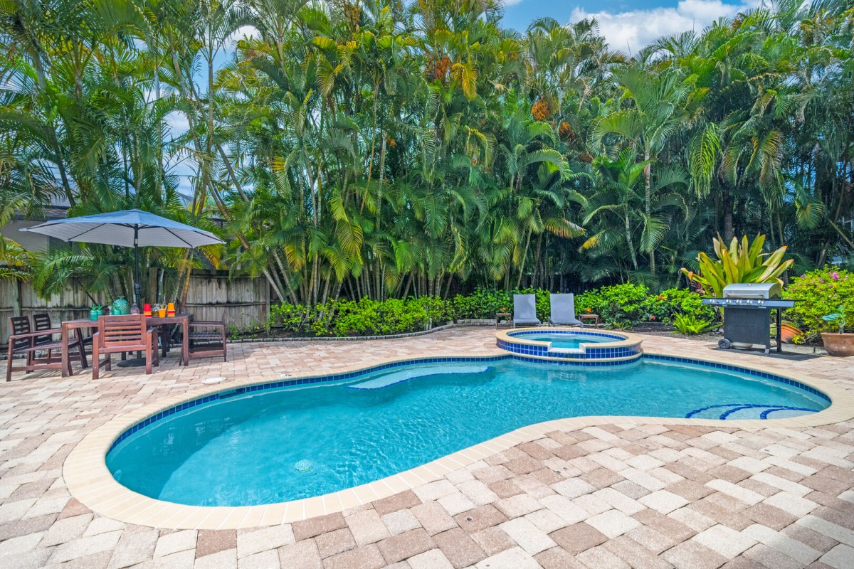Backyard pool and patio.  Private Pool & Spa.  Sitting area with umbrella.  Chaise lounges for soaking up the sun and a propane grill for your ultimate grilled meals!