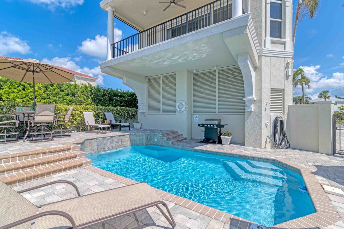Feel the warmth year-round—dip into your crystal-clear, heated pool, just steps from your door and shared with only one other unit.