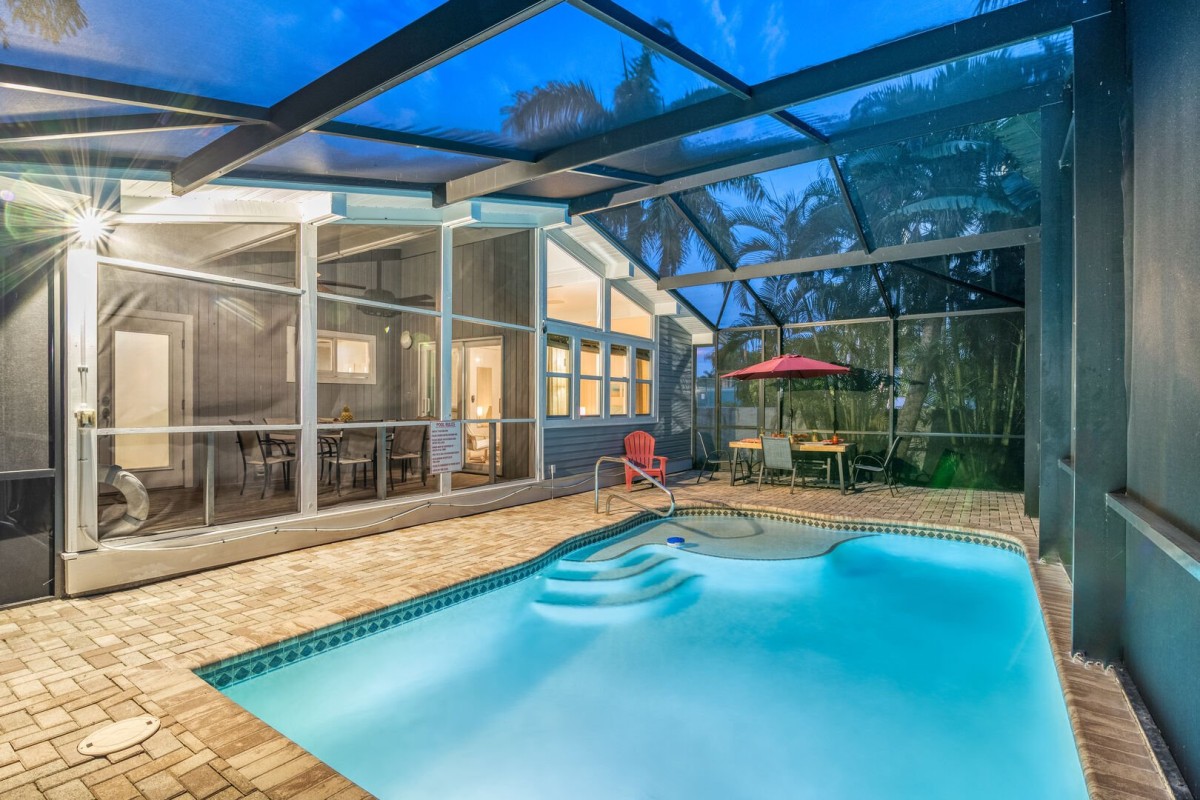 Dive into your private screened-in paradise—this heated pool is all yours.
