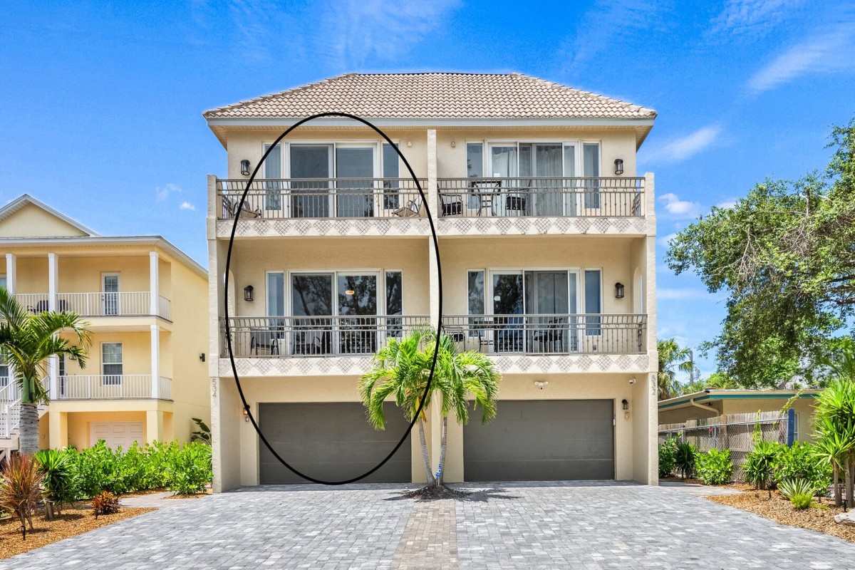 Your vacation retreat! The left side of this duplex is your getaway with balconies and rooftop patio!