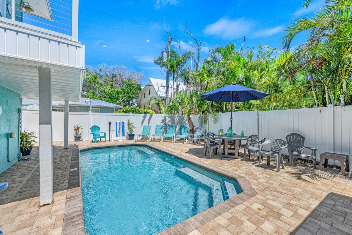 Bright, inviting water and lush greenery create a private-feeling escape just downstairs from your unit.