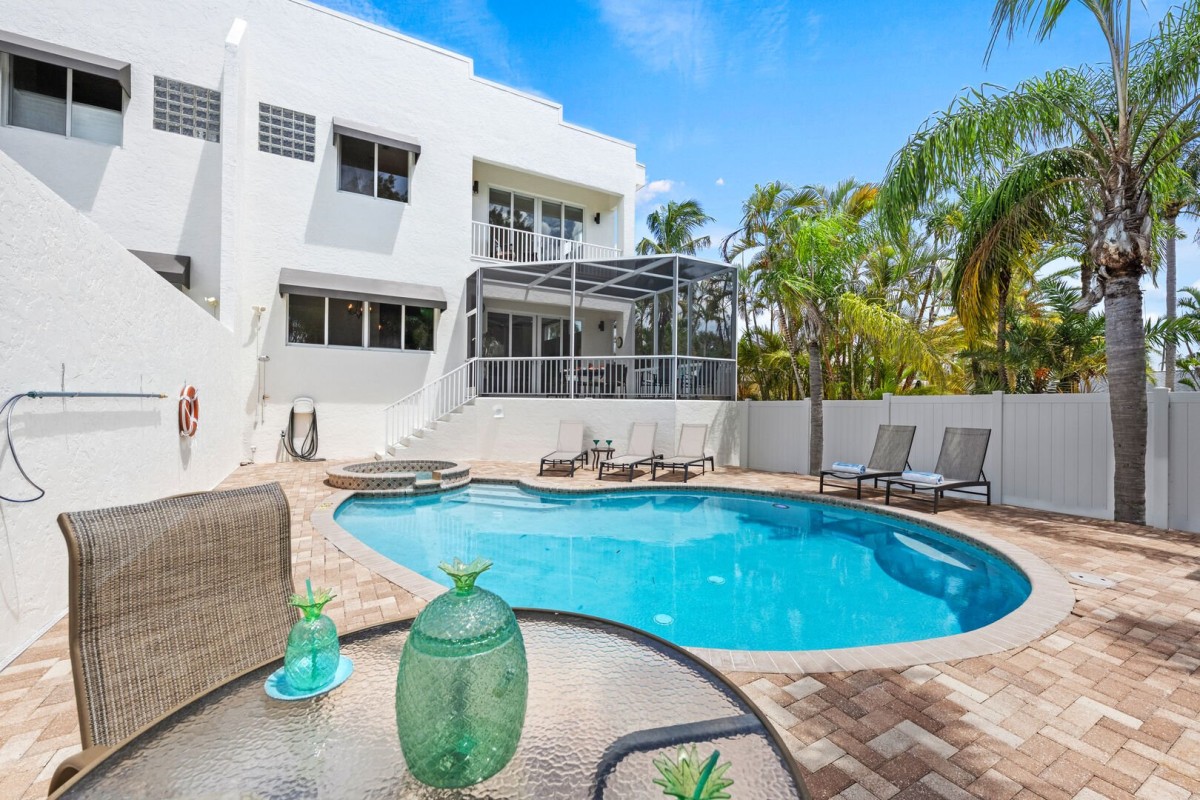 Stretch out under the Florida sun with comfortable loungers placed poolside for total serenity.