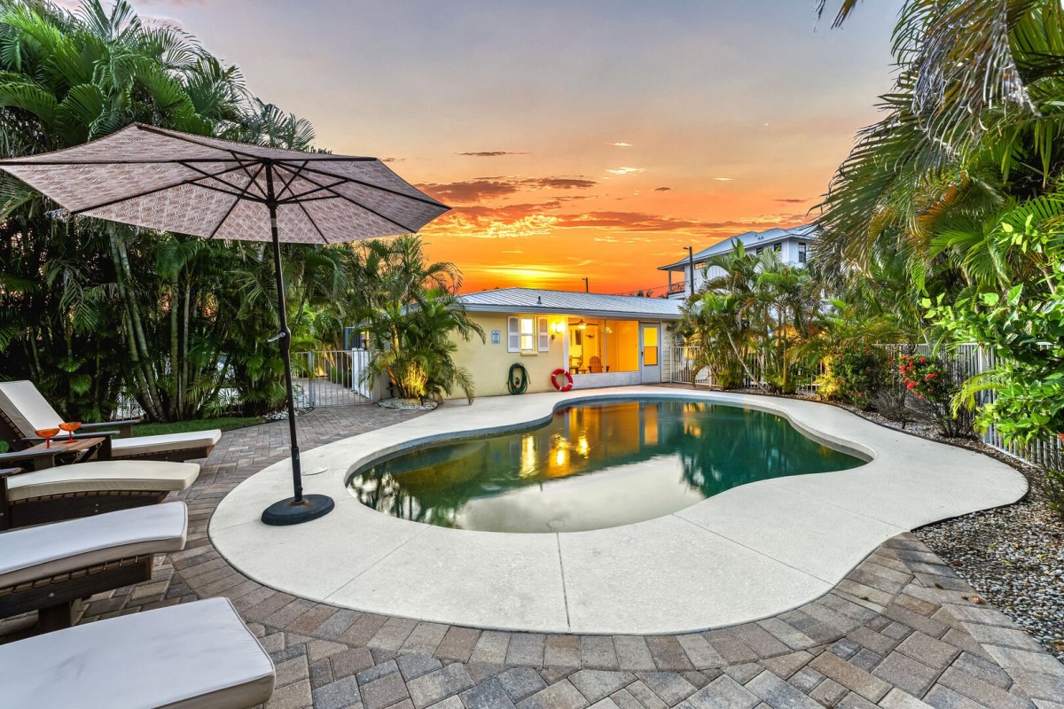 As the sun melts into the horizon, the pool glows golden and still— this is your private slice of paradise.