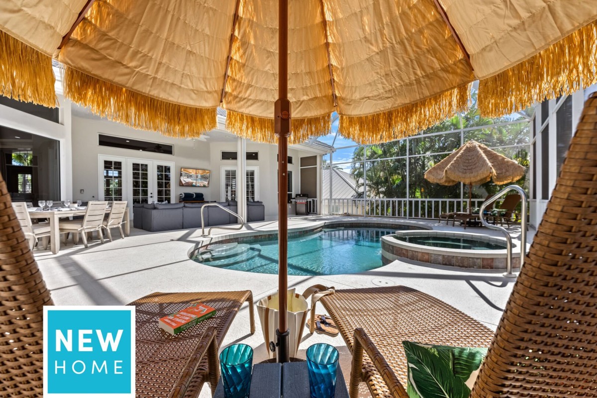 Unwind on poolside chaises facing the elegant lanai, where sparkling water and refined design meet pure relaxation.
