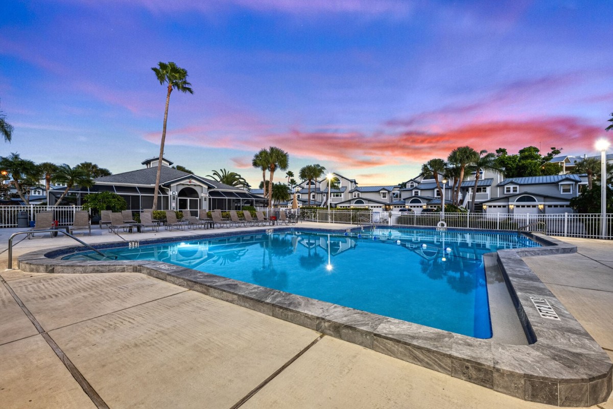 Resort style community pool with plenty of seating, perfect for unwinding at the end of the day.