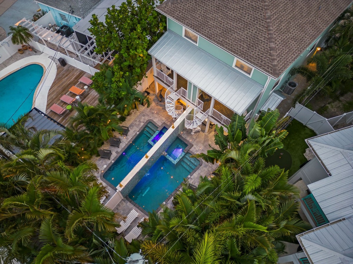 This unique duplex offers two private heated pools and spas, giving everyone room to spread out while staying together.