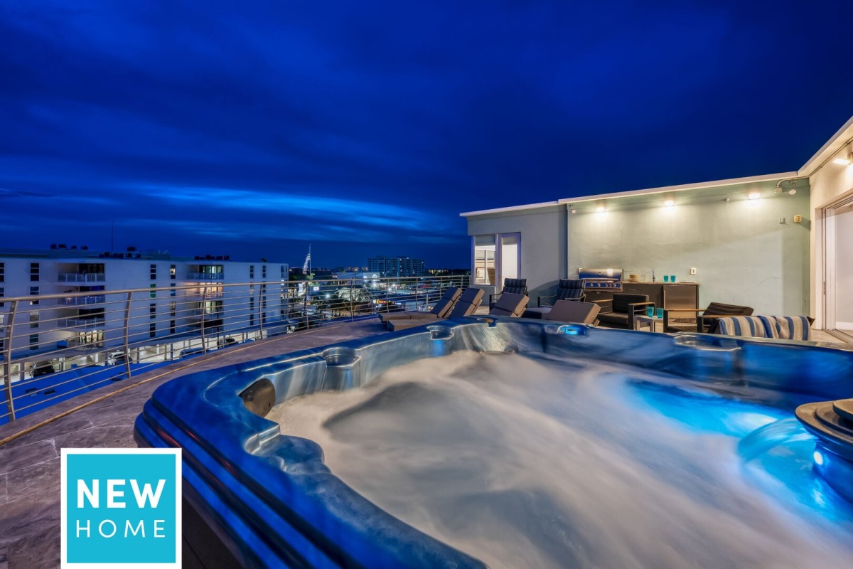 Your private rooftop retreat comes alive after sunset with a bubbling hot tub and unforgettable evening views.