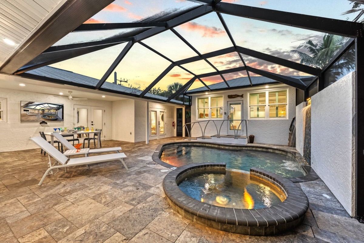 Covered pool area designed for all-day lounging and swimming.