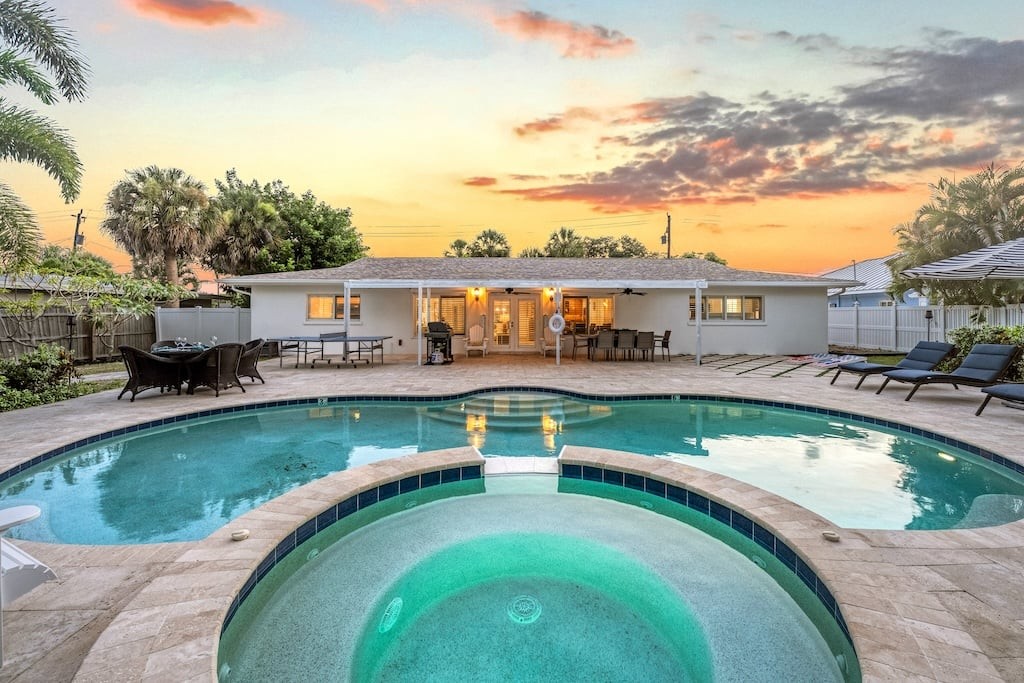 Evenings shine in Blu Sky's expansive backyard featuring a private pool, spa, grilling area, and plenty of room to gather.