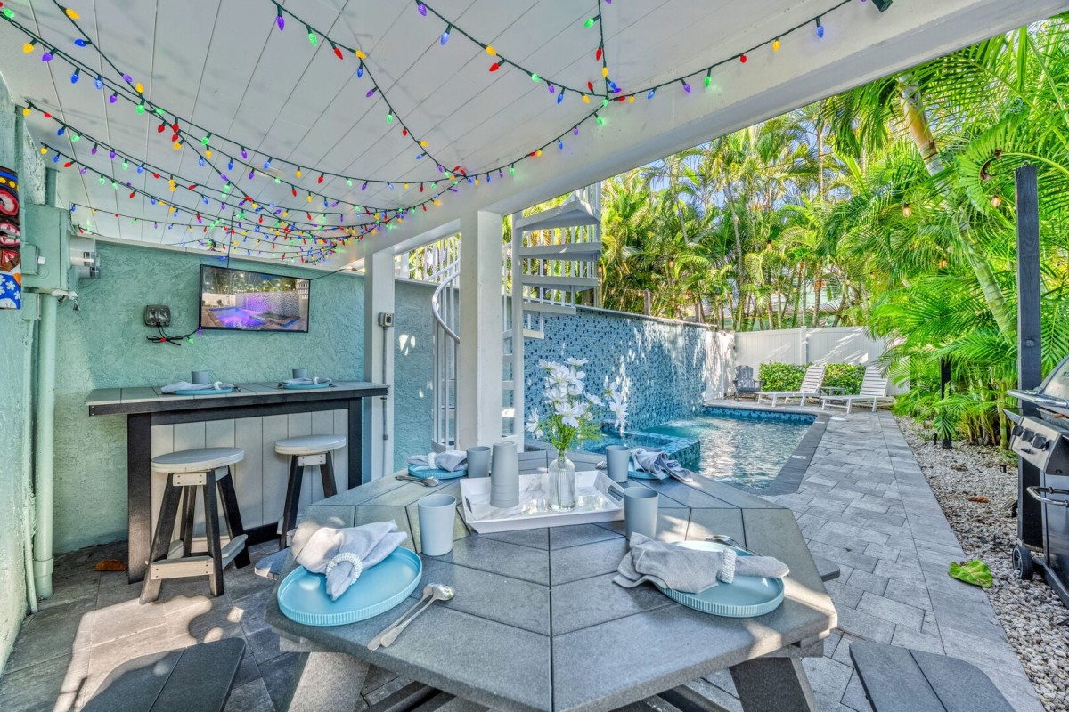 Your own backyard retreat features a heated pool, spa, and covered outdoor entertainment space.