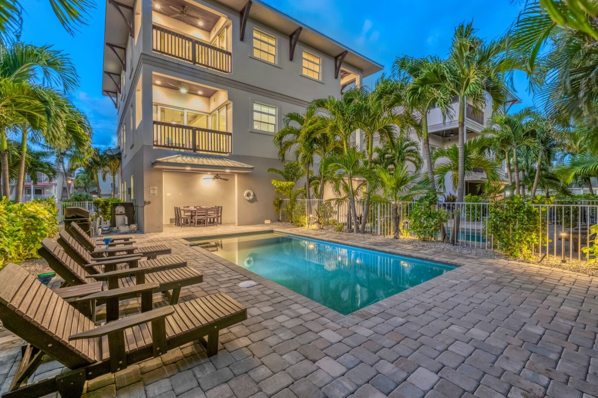 Your private pool takes center stage, surrounded by palms and plenty of space to lounge between swims.