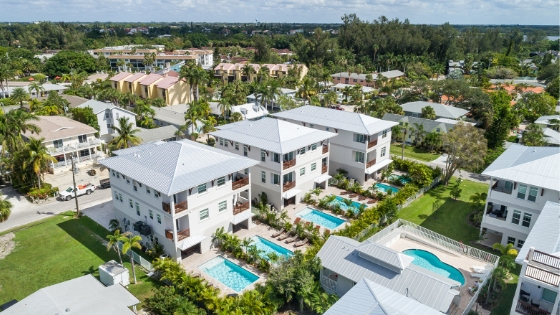 aerial view of rental properties with pools