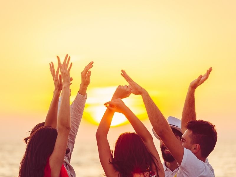 people dancing on siesta key beach