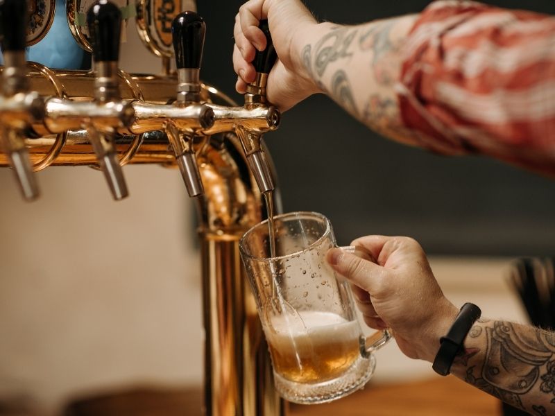 close of of beer pour from tap
