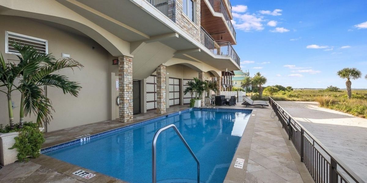The Westshore exterior pool and view of beach