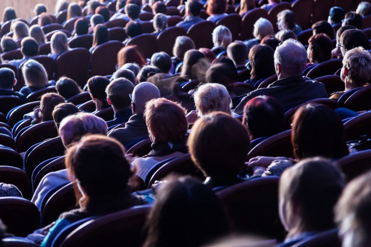 audience seated in a theatre performance