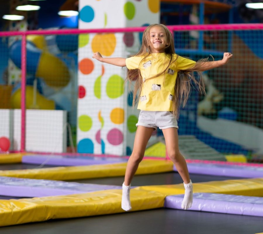 girl jumping at trampoline park