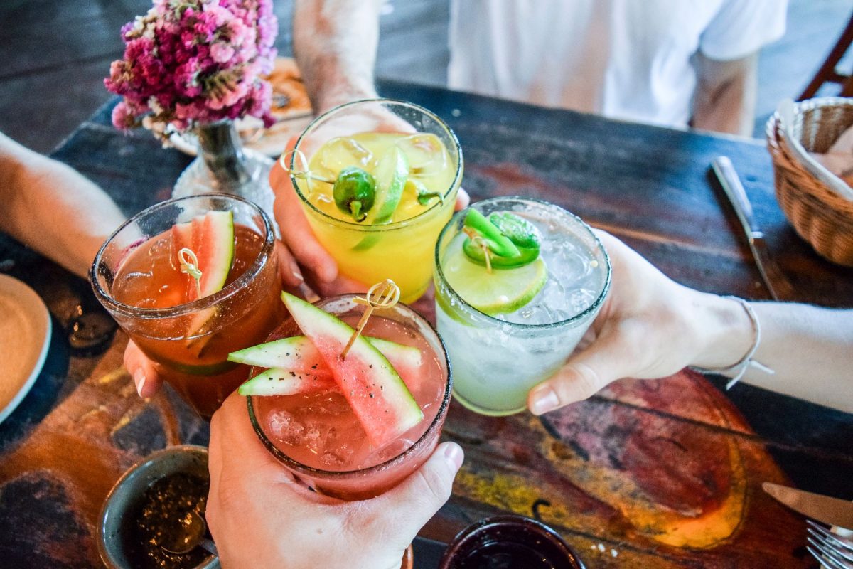 colorful beach cocktails decorated with fruit