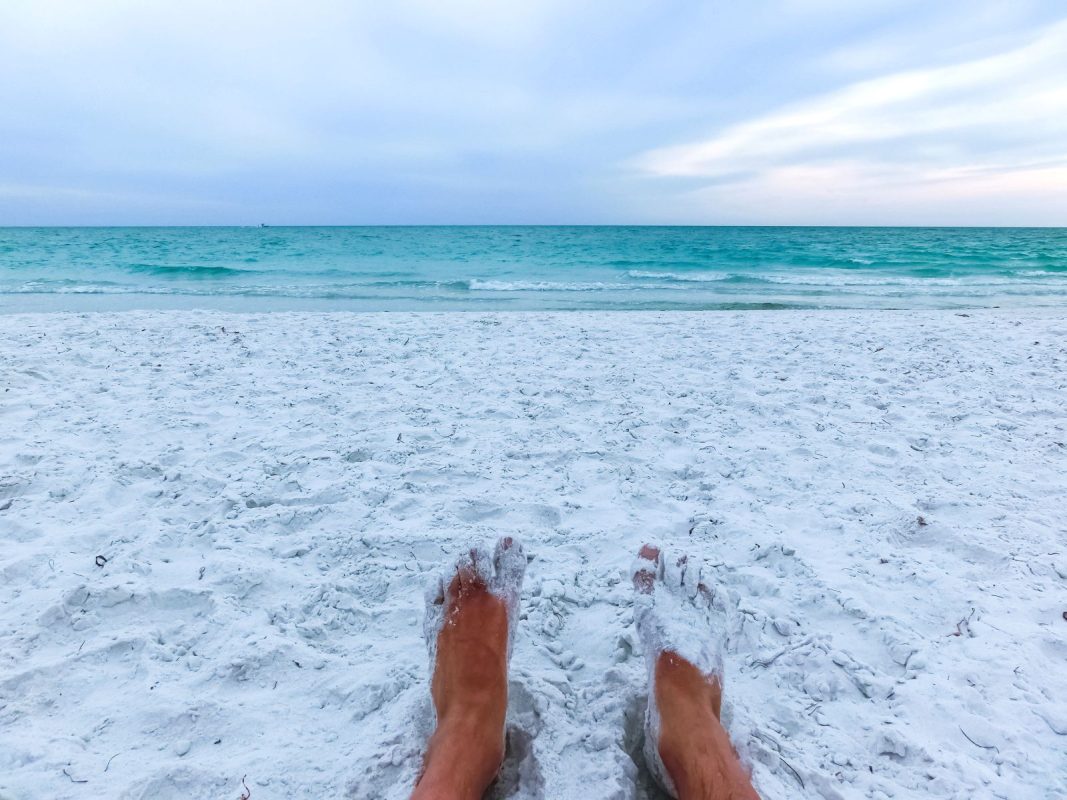 Feet in the sand on Siesta Key beach