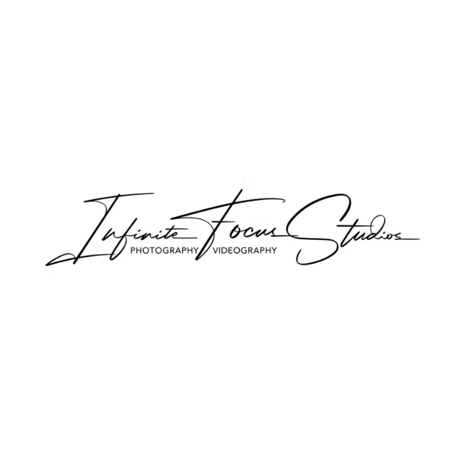 Elegant black ink handwritten script signature logo on a plain white backdrop.