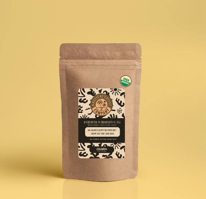 Clean tan paper bag coffee packaging sitting on a plain yellow background.