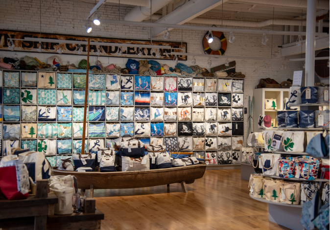 Indoor shot of a beautifully organized retail shop filled with bags and accessories.