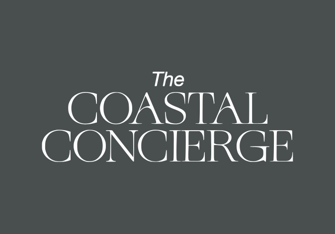 Sophisticated white serif font logo reading The Coastal Concierge on dark grey.